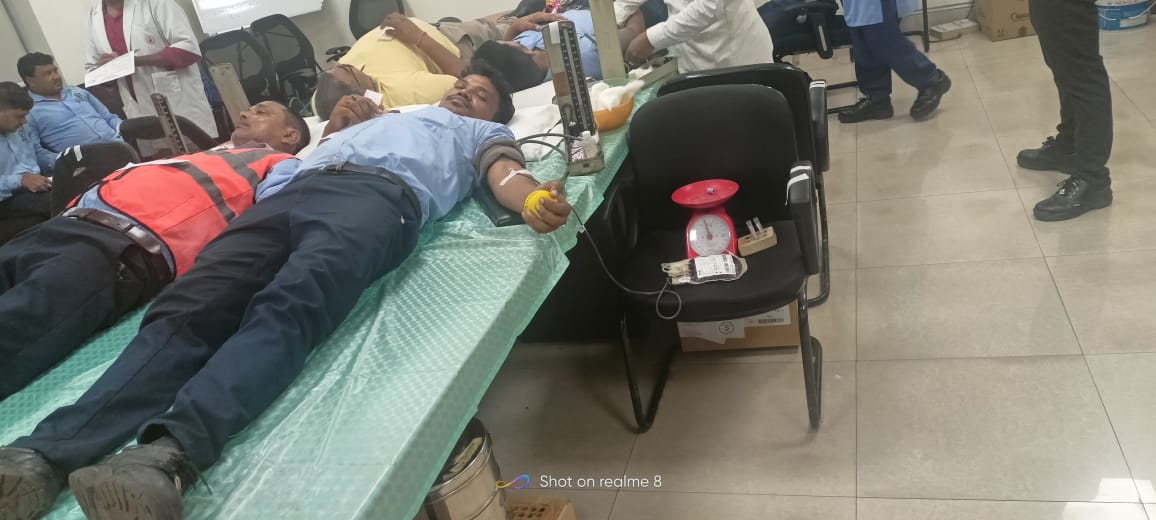 People donating blood at a blood donation camp